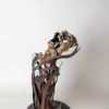 metal and clay sculpture depicting a screaming and breaking appart torso